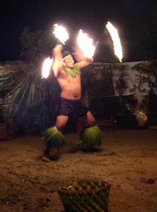 A fire-dance with two flaming batons